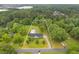 Aerial view of the property line and features lush landscaping, mature trees, and a private pool at 256 Teresa Ln, Loganville, GA 30052
