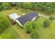 Aerial view of a bright, well-kept property with a fenced in pool area and lush landscaping at 256 Teresa Ln, Loganville, GA 30052