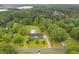 Aerial view of home with pool surrounded by lush greenery and a private setting at 256 Teresa Ln, Loganville, GA 30052