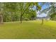 Spacious backyard with mature trees, perfect for outdoor activities and relaxation at 256 Teresa Ln, Loganville, GA 30052