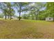 Expansive backyard with mature trees, providing a serene and private outdoor setting at 256 Teresa Ln, Loganville, GA 30052