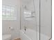 Stylish bathroom showcasing a tiled shower-over-tub and modern toilet at 256 Teresa Ln, Loganville, GA 30052