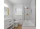 Beautifully updated bathroom featuring modern fixtures, including a shower over tub and white vanity at 256 Teresa Ln, Loganville, GA 30052