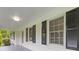 Covered front porch with black shutters and windows create an inviting curb appeal at 256 Teresa Ln, Loganville, GA 30052