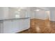 Living room with white cabinets, hardwood floors, and open access to the kitchen at 256 Teresa Ln, Loganville, GA 30052
