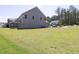 Large grassy backyard, showcasing ample space for outdoor activities and recreation at 8 Foothills Trl, Sharpsburg, GA 30277