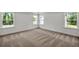 Bright bedroom with large windows providing ample natural light at 8 Foothills Trl, Sharpsburg, GA 30277