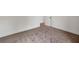 Neutral carpeted floor with white baseboards in this empty bedroom space at 8 Foothills Trl, Sharpsburg, GA 30277