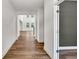 Bright hallway with wood floors leads into the open and airy living space at 8 Foothills Trl, Sharpsburg, GA 30277