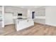 Spacious kitchen featuring a large island, stainless steel appliances, and abundant cabinet space at 8 Foothills Trl, Sharpsburg, GA 30277