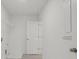The laundry room with shelving and access to other areas in the home at 8 Foothills Trl, Sharpsburg, GA 30277