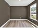 Neutral-toned office space featuring a large window and laminate flooring at 8 Foothills Trl, Sharpsburg, GA 30277