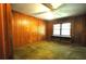 Cozy bedroom with wood paneled walls, vintage carpet, and good natural light at 1305 Lenox Cir, Atlanta, GA 30306