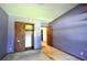 A cozy bedroom with purple walls and closet is ready for design touches at 1305 Lenox Cir, Atlanta, GA 30306