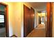 Hallway with multiple storage closets and doors leading to various rooms at 1305 Lenox Cir, Atlanta, GA 30306