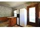 Vintage kitchen design with floral wallpaper, wood accents, and an antique refrigerator at 1305 Lenox Cir, Atlanta, GA 30306
