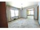 Bright living room with chandelier and view into adjacent room at 1305 Lenox Cir, Atlanta, GA 30306