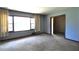 Spacious living room with large windows and access to hallway at 1305 Lenox Cir, Atlanta, GA 30306