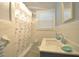 Bathroom featuring white tile, a decorative shower curtain, and vanity sink at 1332 Euclid Ave # C, Atlanta, GA 30307