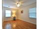 A bright bedroom with hardwood floors and two windows that let in plenty of natural light at 1332 Euclid Ave # C, Atlanta, GA 30307