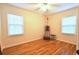 Cozy bedroom with hardwood floors and natural light from two windows at 1332 Euclid Ave # C, Atlanta, GA 30307