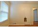 Bright bedroom with a window and hardwood floors with view of a doorway at 1332 Euclid Ave # C, Atlanta, GA 30307