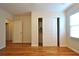Spacious bedroom features hardwood floors, natural light, and sliding door closet at 1332 Euclid Ave # C, Atlanta, GA 30307