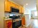 Updated kitchen with stainless steel appliances, granite countertops and a view to living room at 1332 Euclid Ave # C, Atlanta, GA 30307