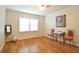 A beautiful living room with hardwood floors, bright windows, and vintage decor accents at 1332 Euclid Ave # C, Atlanta, GA 30307