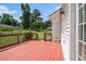 Inviting wooden deck offering a relaxing outdoor space, overlooking a lush green lawn and a serene backyard at 1644 Beaver Creek Ln, Snellville, GA 30078
