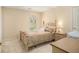 Cozy bedroom with neutral walls, carpet flooring, and a quaint window overlooking the outdoor scenery at 1644 Beaver Creek Ln, Snellville, GA 30078