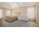 Tranquil main bedroom features soft natural light, a ceiling fan, and a soothing color palette at 1644 Beaver Creek Ln, Snellville, GA 30078