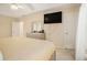 Light-filled main bedroom features neutral colors, a ceiling fan, and plenty of room for large furniture at 1644 Beaver Creek Ln, Snellville, GA 30078