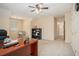 Comfortable carpeted office space with a ceiling fan, neutral walls and natural light from the window at 1644 Beaver Creek Ln, Snellville, GA 30078