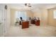 Spacious home office featuring a large desk, neutral walls, carpet flooring and lots of natural light at 1644 Beaver Creek Ln, Snellville, GA 30078