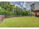 Spacious backyard with a play area and tall trees at 270 Alcovy Reserve Way, Covington, GA 30014