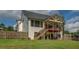 Great backyard showcasing a covered deck, stairway, and comfortable seating at 270 Alcovy Reserve Way, Covington, GA 30014