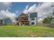 Large backyard with a multi-tiered deck and a well-maintained lawn at 270 Alcovy Reserve Way, Covington, GA 30014