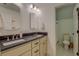 Bathroom featuring a double vanity with dark countertops and a separate toilet at 270 Alcovy Reserve Way, Covington, GA 30014