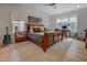 Large bedroom with hardwood floors, office space, sitting chair, and a well-decorated interior at 270 Alcovy Reserve Way, Covington, GA 30014