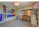 Bedroom features a lofted bed, desk, ladder, and ribbon wall decor at 270 Alcovy Reserve Way, Covington, GA 30014