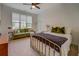Bright bedroom with neutral tones, large windows, comfortable seating area, and stylish furnishings at 270 Alcovy Reserve Way, Covington, GA 30014