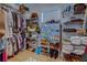 Walk-in closet with hardwood floors, shelving, and an organized storage system at 270 Alcovy Reserve Way, Covington, GA 30014