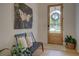 Bright entryway with a decorative wreath, modern furniture, and hardwood floors at 270 Alcovy Reserve Way, Covington, GA 30014