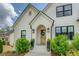 Inviting front porch features a beautifully decorated entrance and manicured bushes at 270 Alcovy Reserve Way, Covington, GA 30014