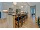 Bright kitchen with large island, seating, modern appliances and hardwood floors at 270 Alcovy Reserve Way, Covington, GA 30014