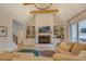 Vaulted living room with a fireplace, wooden beams, built-ins, and open floor plan at 270 Alcovy Reserve Way, Covington, GA 30014