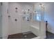 Shower with white subway tile, a built-in bench, and dark honeycomb tile floor at 270 Alcovy Reserve Way, Covington, GA 30014