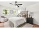 Bright bedroom boasts natural light, a ceiling fan, and a neutral color palette at 3337 Toney Dr, Decatur, GA 30032