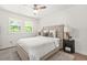 Cozy bedroom showcasing a comfortable bed, ceiling fan, and serene natural light through windows at 3337 Toney Dr, Decatur, GA 30032